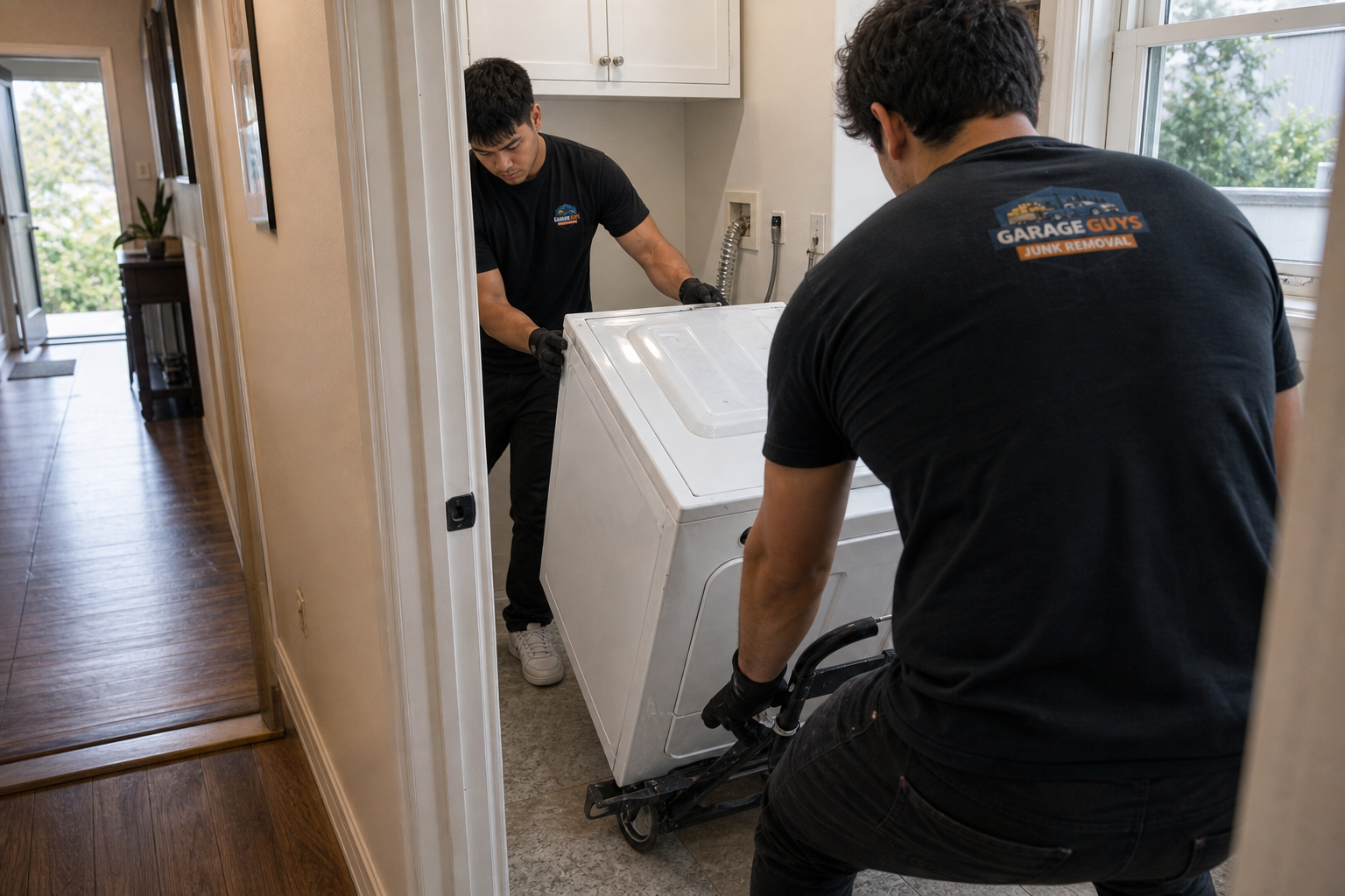 Washer and dryer removal from a laundry room by GarageGuys Junk Removal